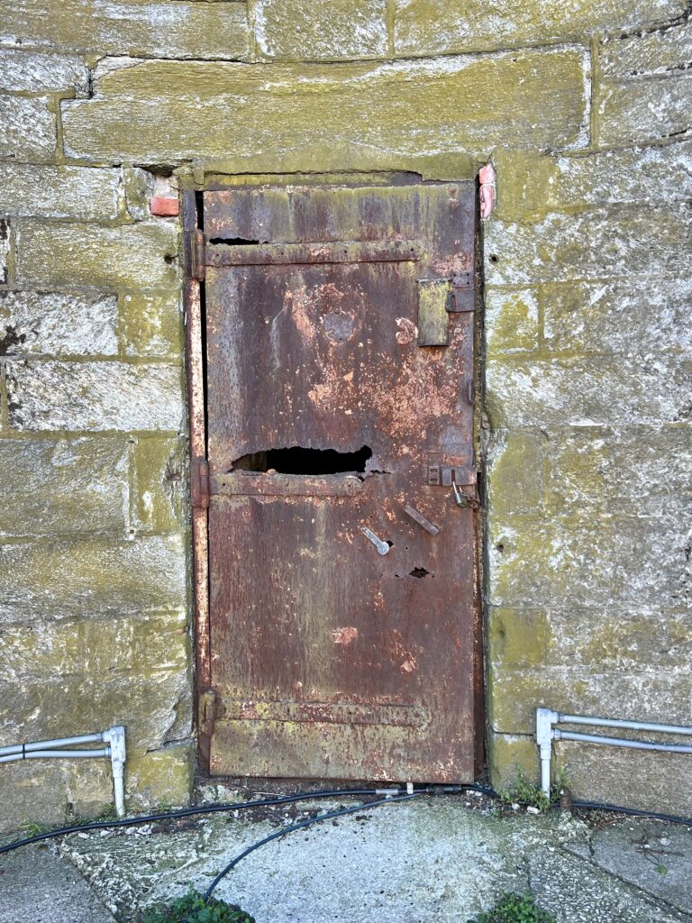 rusty iron cell door