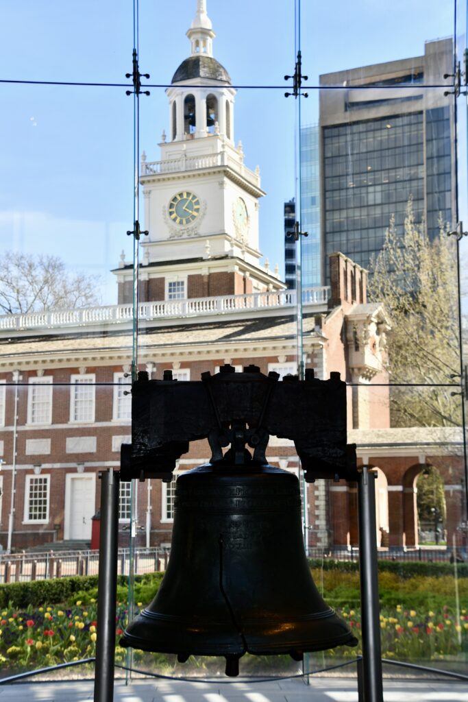 view of the Liberty Bell and Independence hall from inside the Liberty bell center