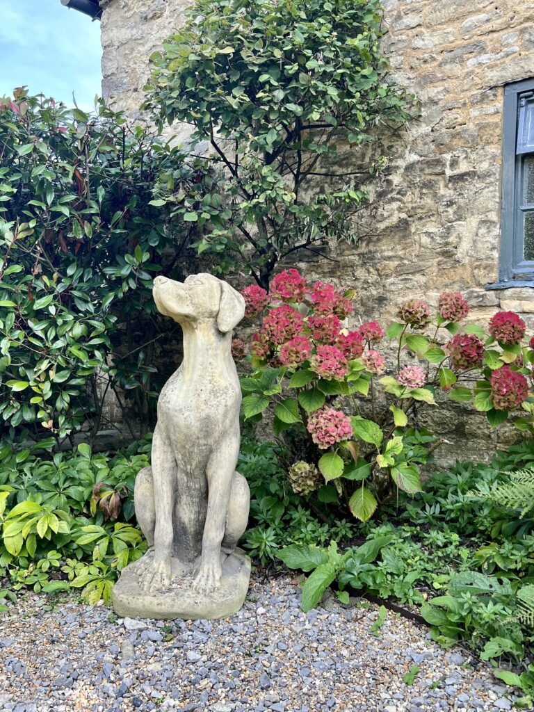 stone statue of a dog in Burford