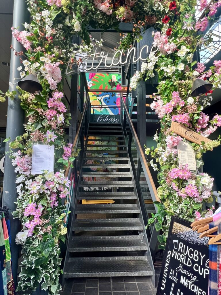 flowery entrance to Chase Distillery in Spitalfields market