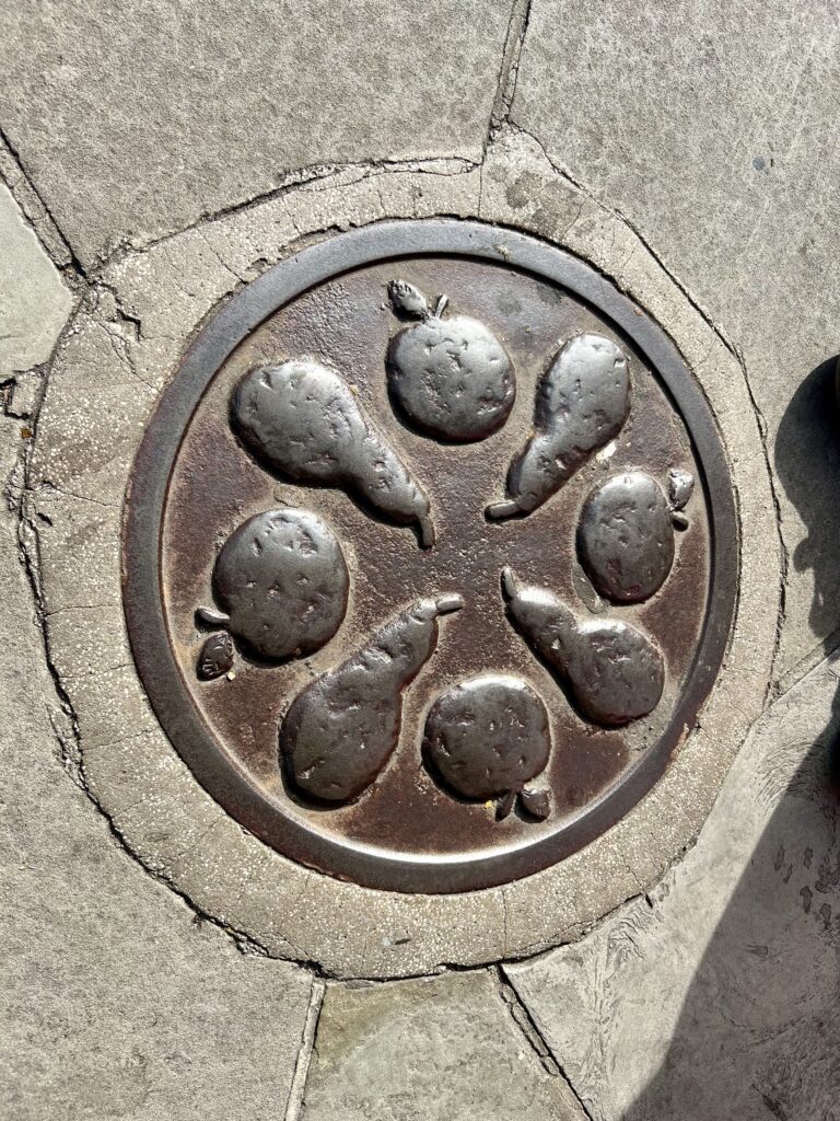 bronze plaque with apples and pears on Commercial Street
