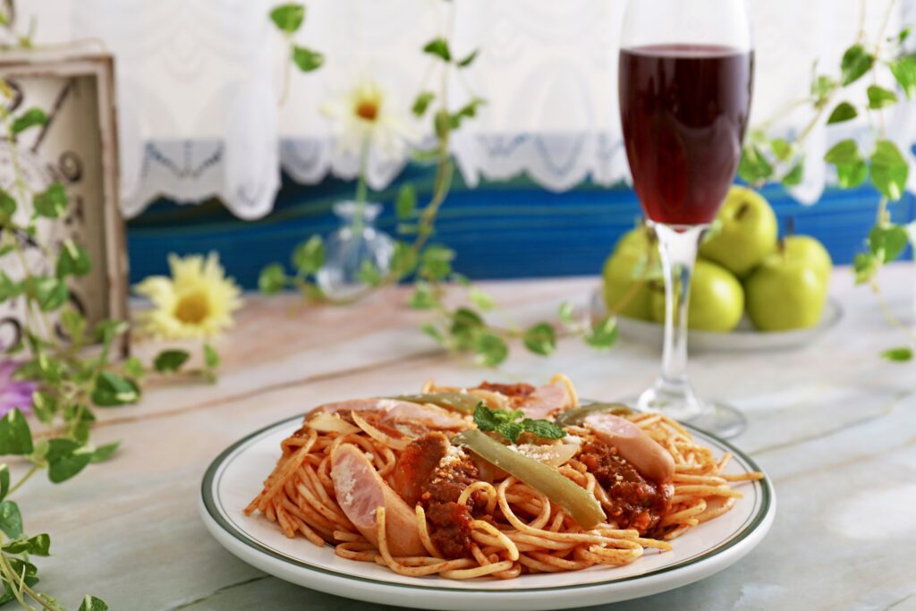 dining table with pasta and wine
