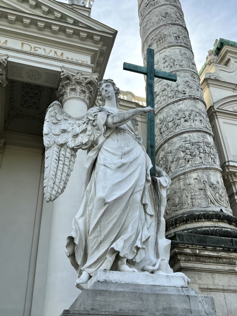 angel statue with cross
