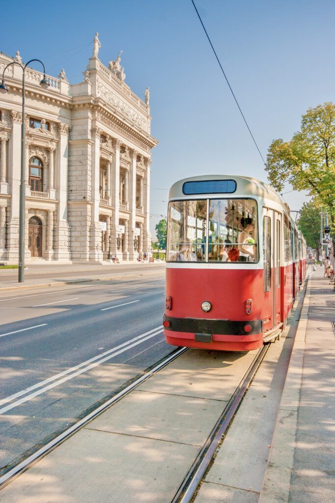 Burgtheater on the Ringstrasse with red tram