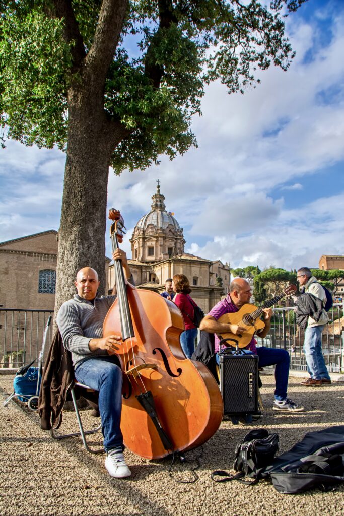 street musicians playing on Via dei Fori Imperiali