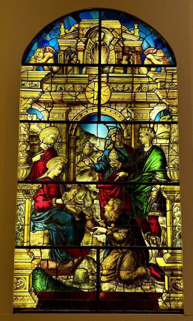 stained glass window depicting the adoration of the magi