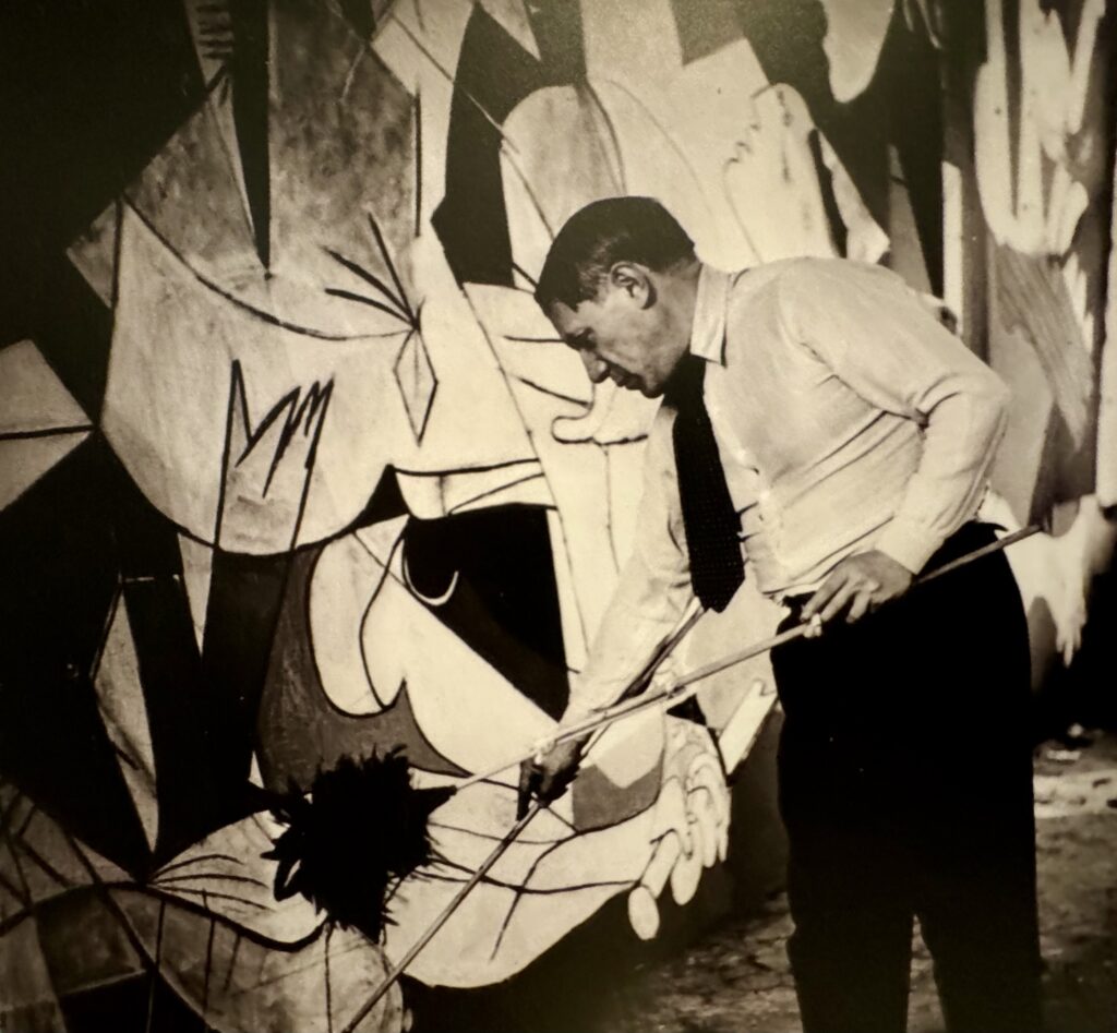 photo of Picasso creating Guernica