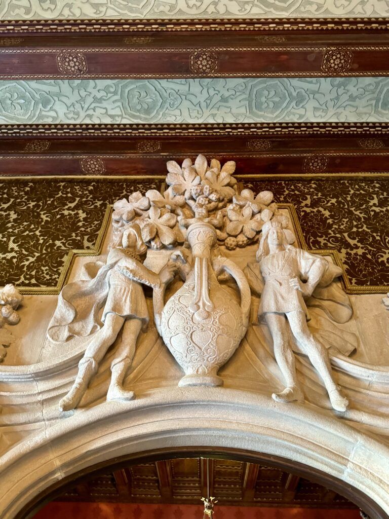 sculpture above fireplace