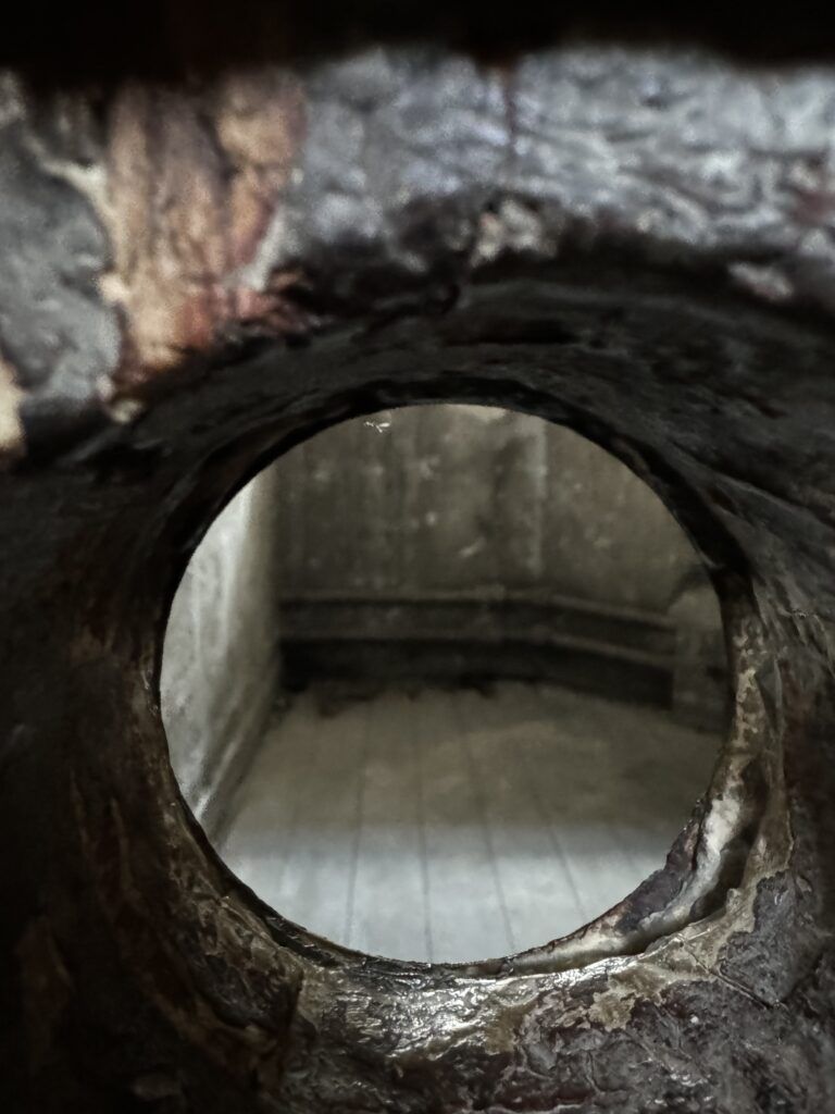 spy hole into cell
