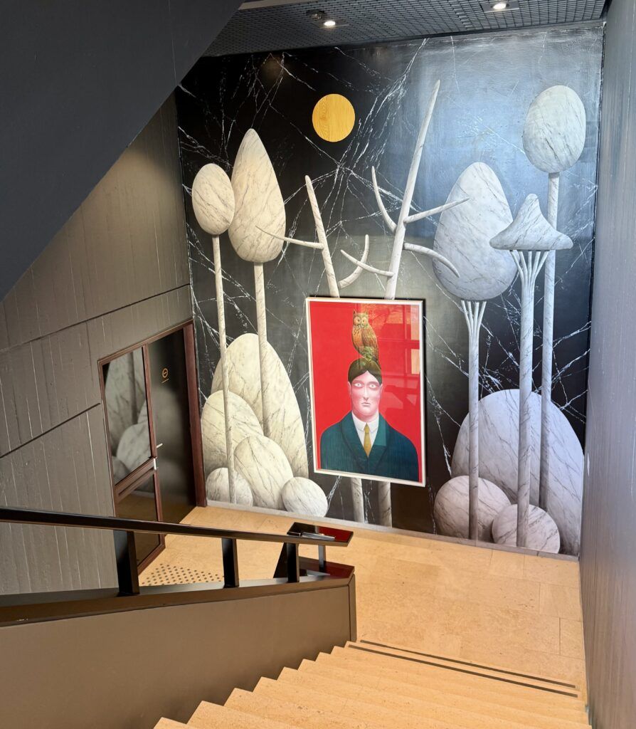 hallway with Magritte-themed decorations