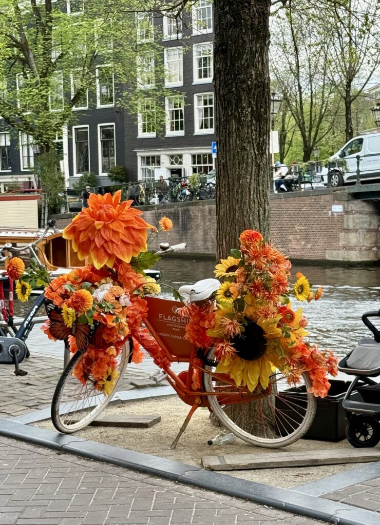 orange bike covered in flowers