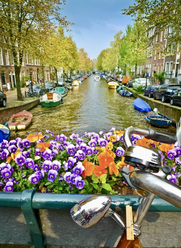 bike and flowers on a canal bridge