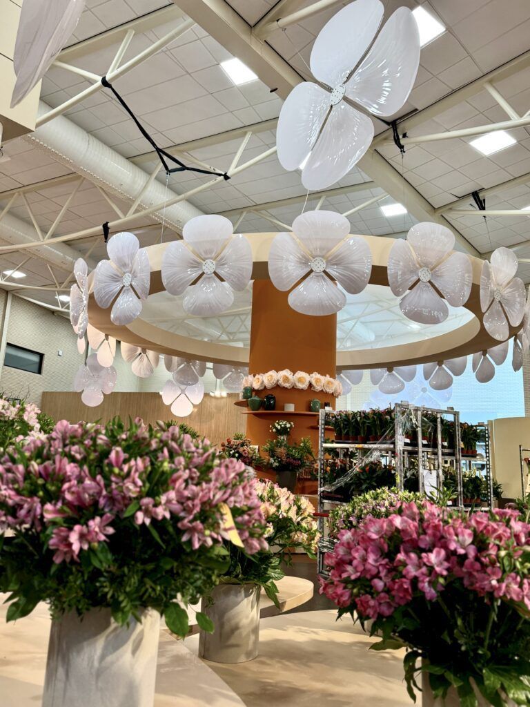 bouquets of flowers in a contemporary setting with flower chandeliers