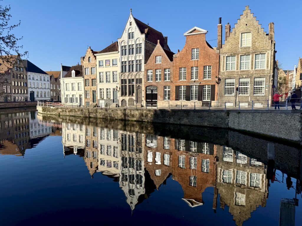 Flemish architecture reflected in a canal in Bruges
