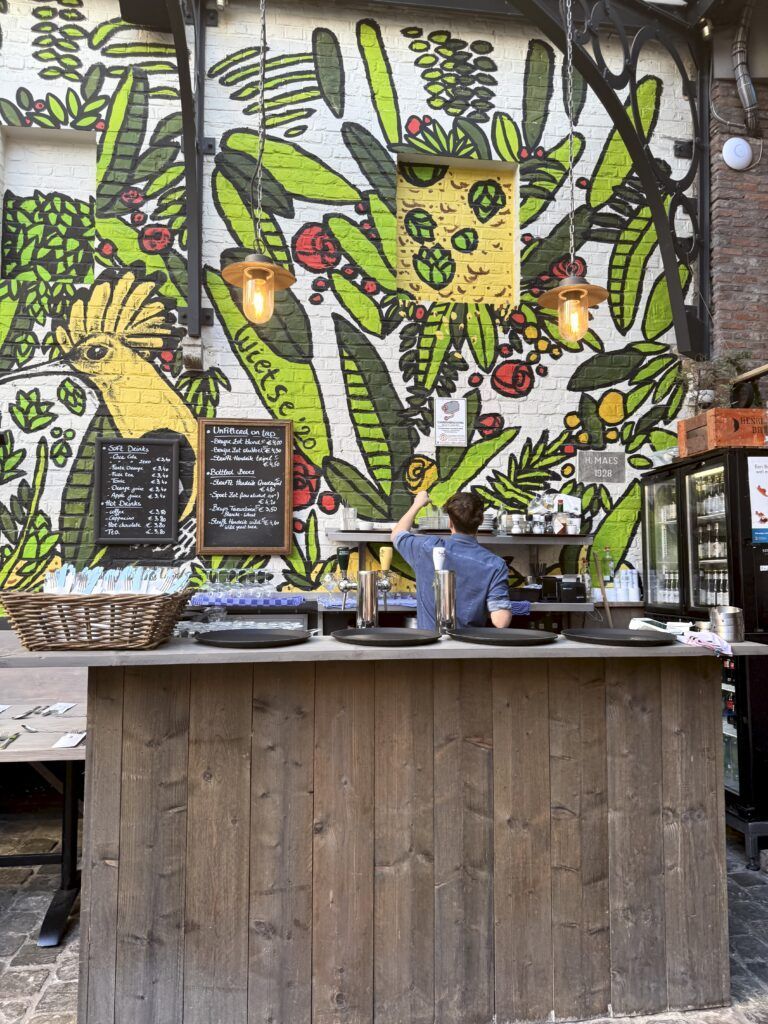 bar at the Half Man Brewery with a colorful mural