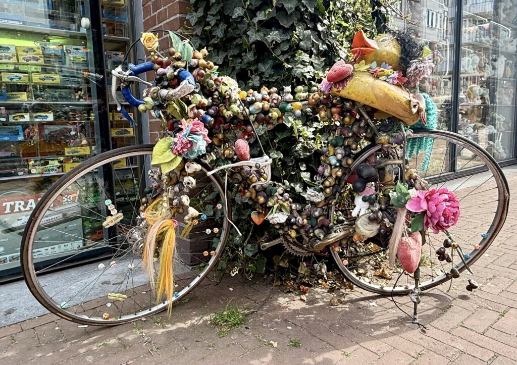 bike covered in flowers along one of Amsterdam's canals
