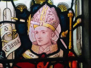stained glass image of Becket with a sword through his head
