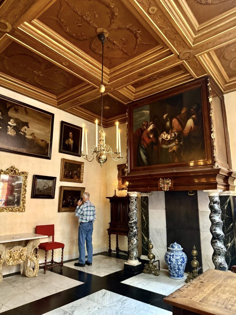 living room with beams and paintings