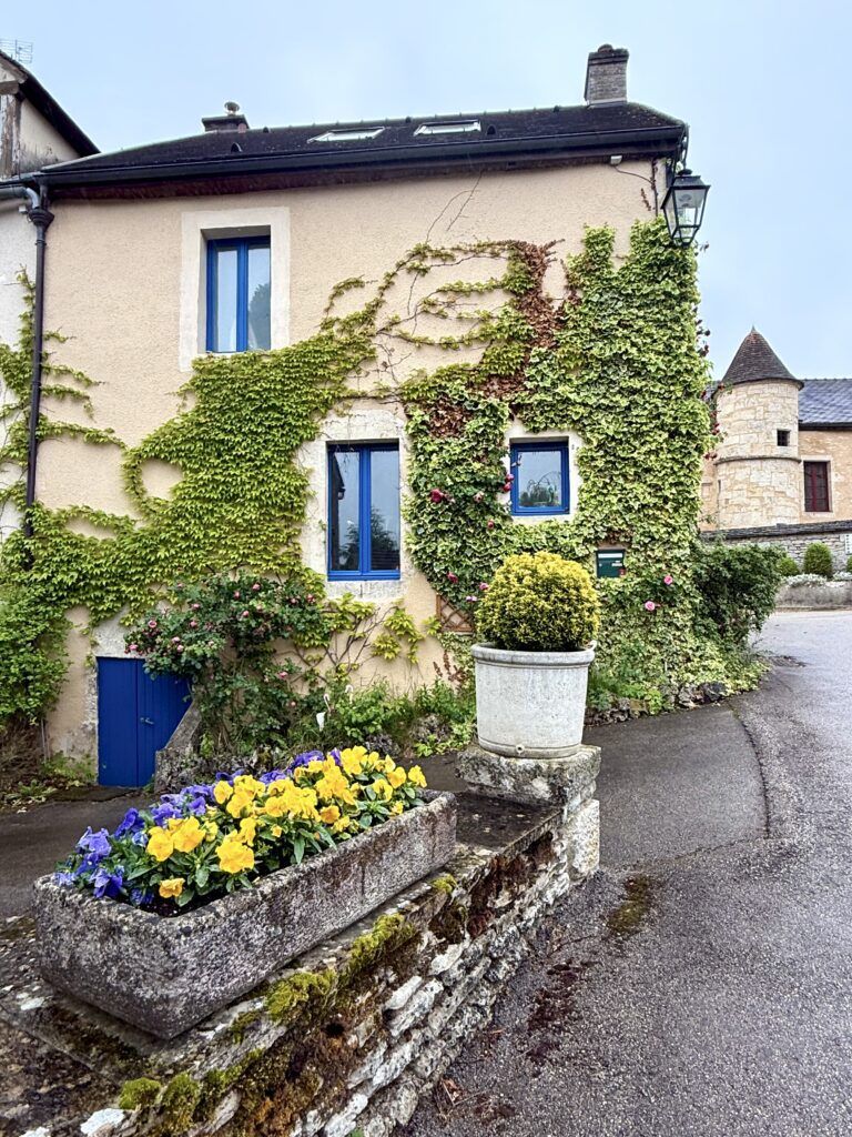 stone house with flowers in Flavigny