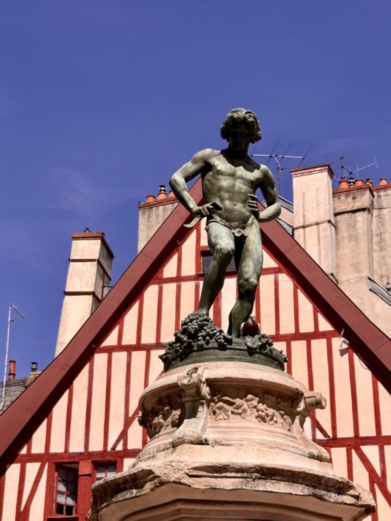 statue of tipsy wine grower in Place Francoise Rude