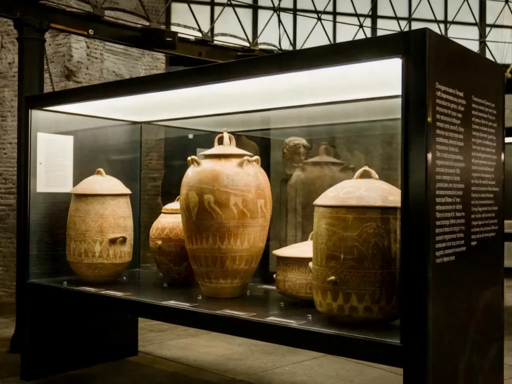 ancient vases in a display case in the Museum of Rescued Art