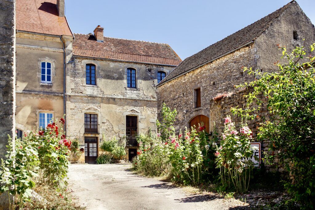 old stone houses with flowers