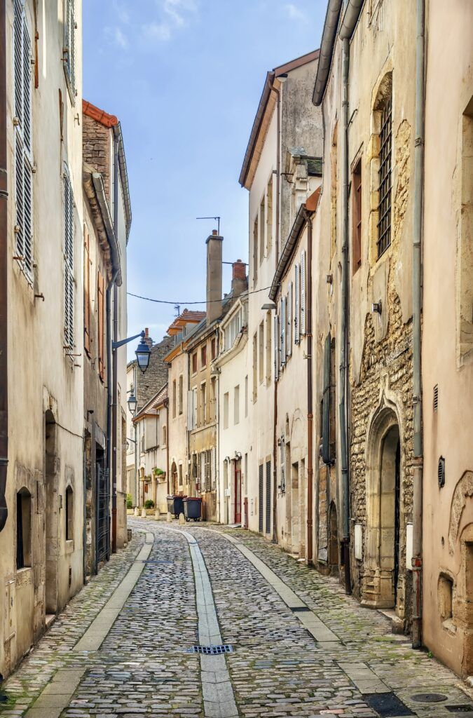 street with historic stone houses in Beaune