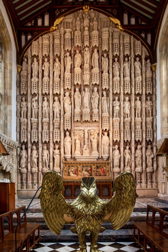 with medieval carved reredes behind the altar in All Souls Chapel