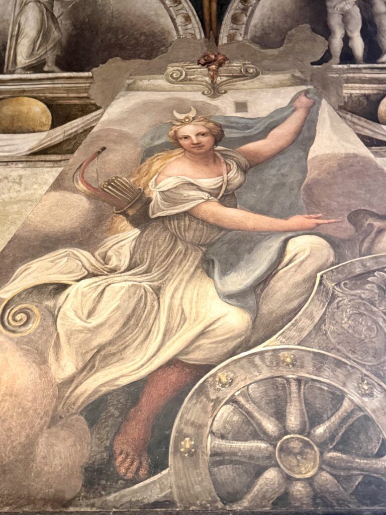painting of Diana on the fireplace