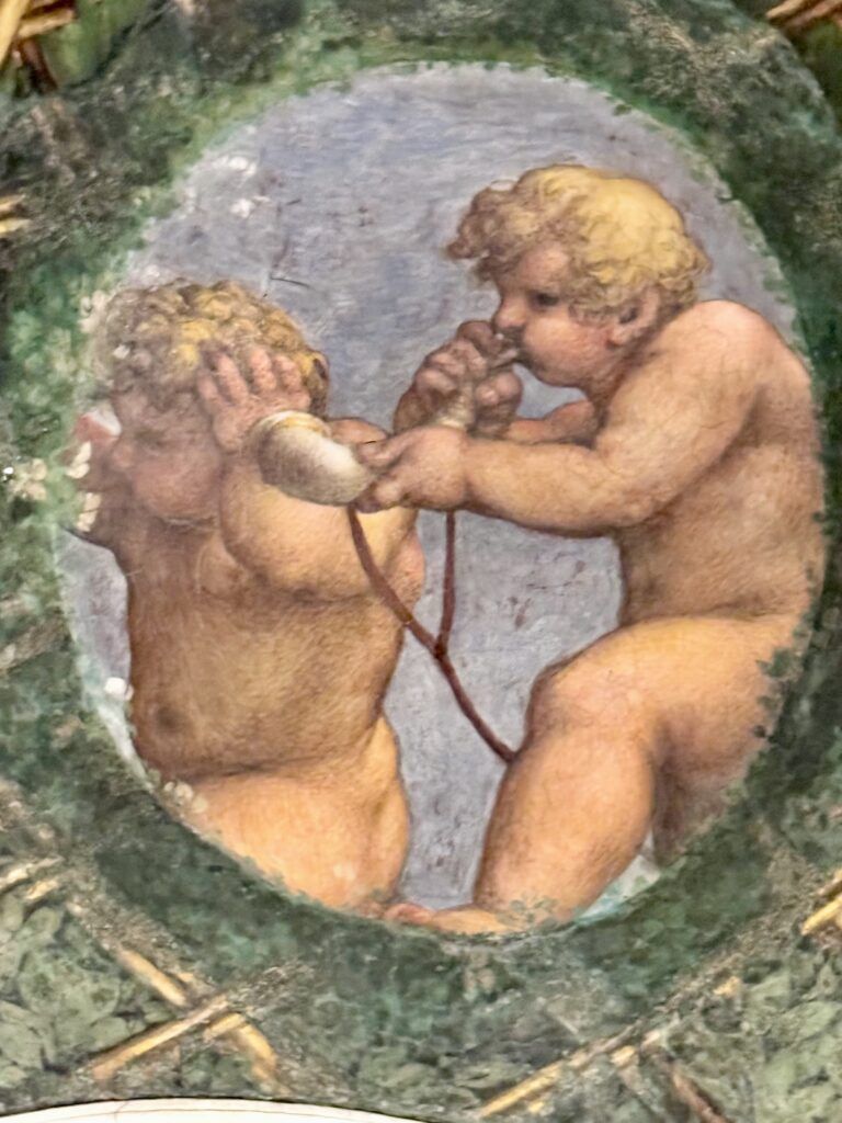 putti blowing horns