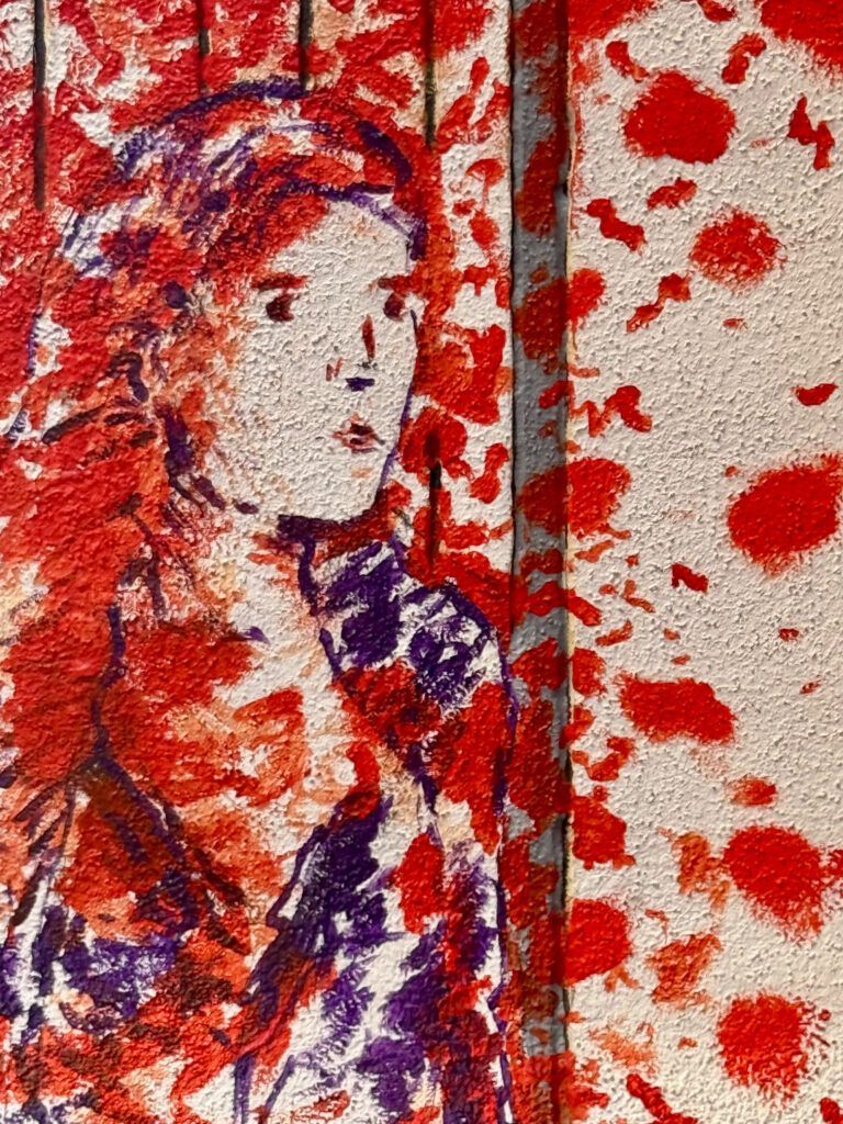 street art mural of woman with red splotches