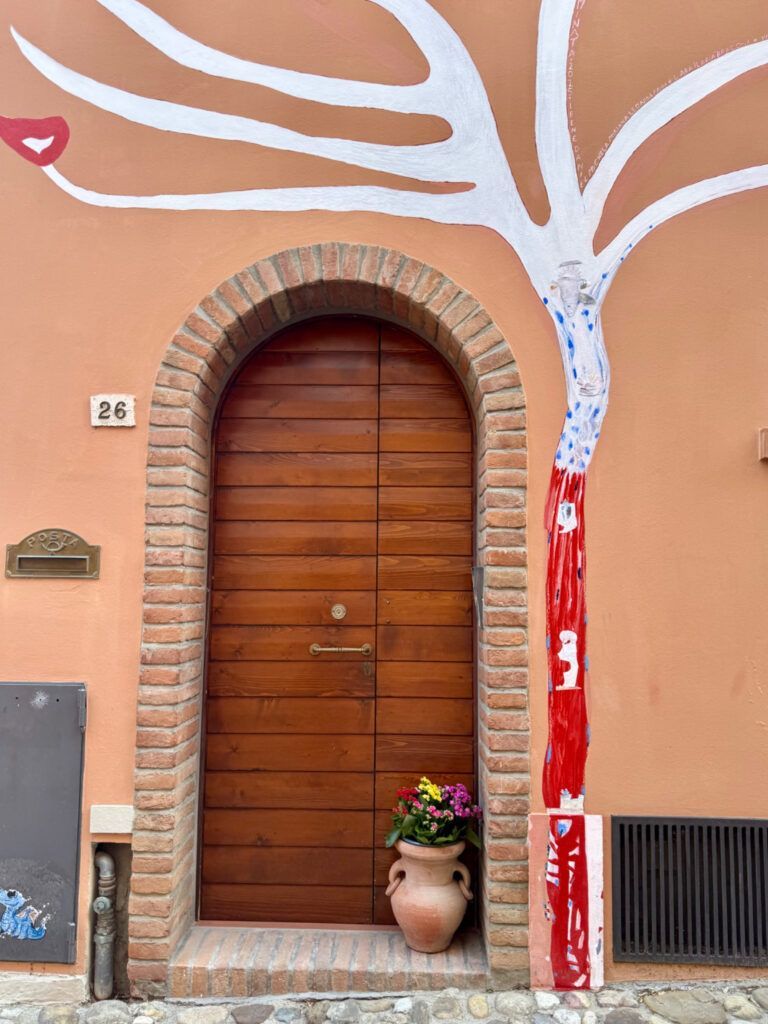 street art mural of a tree around a door