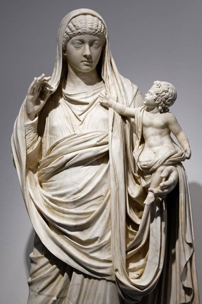a statue of Messaline holding Brittanicus