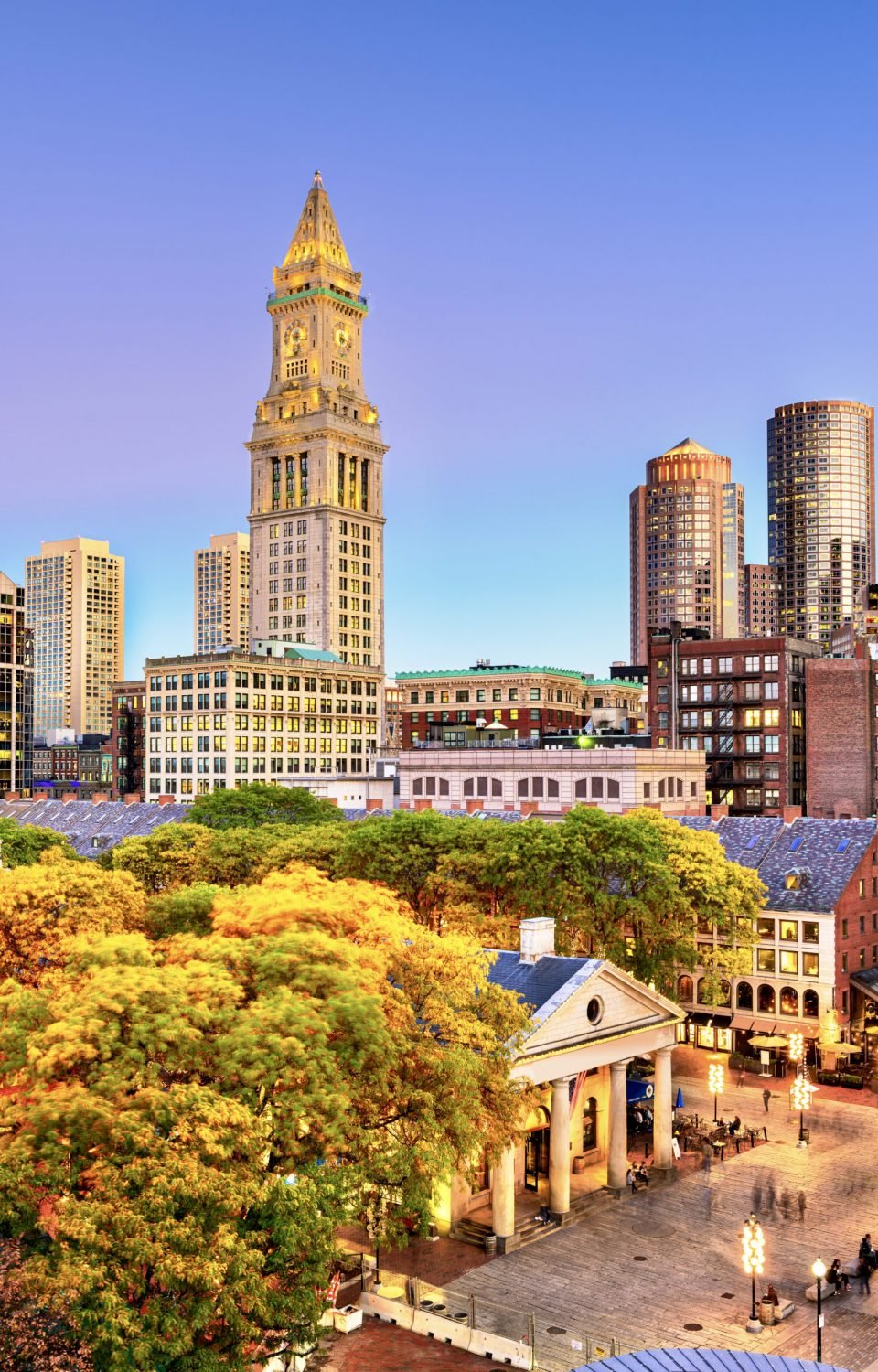 Boston, Massachusetts, USA skyline with Faneuil Hall and Quincy Market at dusk.